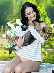 Alluring, dark brooding eyes with sultry stare, magnificent, large breasts, and lots of arousing and tempting poses, Jenya\'s seductive beauty stands out in the green vibrant background.
