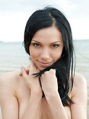 Lily loves outdoor photo shoots, especially on sandy seashores, savoring the cool, balmy wind that makes her breasts erect and stiff, and the cool, frothy water on her skin.