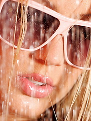 Glonde in bikini getting wet