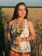 Arina G show off her hairy pussy in a field