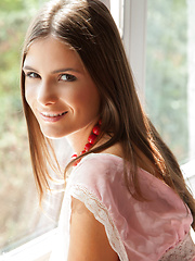 A baby pink dress compliments Csilla\'s sweet and charming appeal