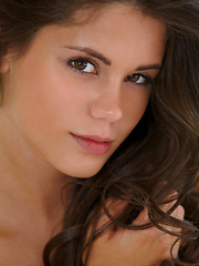 Sultry sizzler Caprice entertains her fans with a sensual striptease before hitting the sheets, showcasing her slender body with delicate assets.